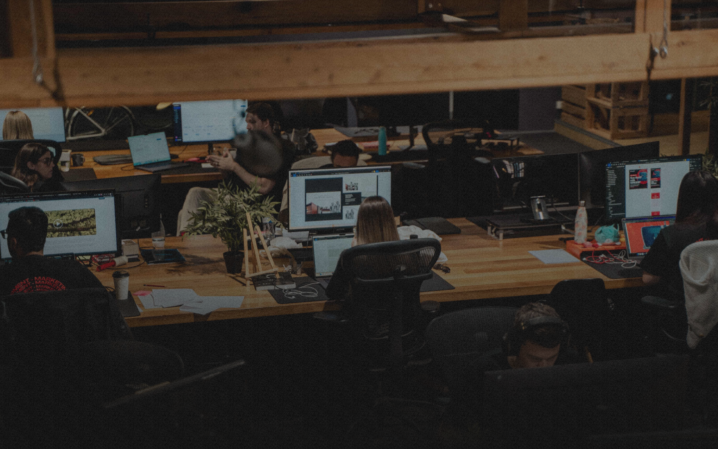 People working at desks in an office.